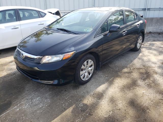 Photo 1 VIN: 2HGFB2F51CH565409 - HONDA CIVIC LX 