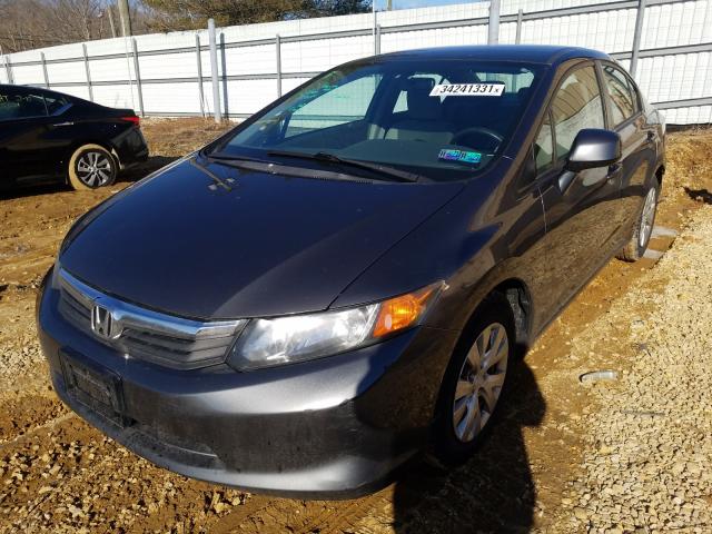 Photo 1 VIN: 2HGFB2F57CH605606 - HONDA CIVIC LX 