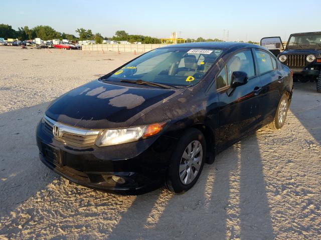 Photo 1 VIN: 2HGFB2F59CH310832 - HONDA CIVIC LX 