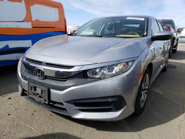 Photo 1 VIN: 2HGFC2F5XGH570143 - HONDA CIVIC LX 