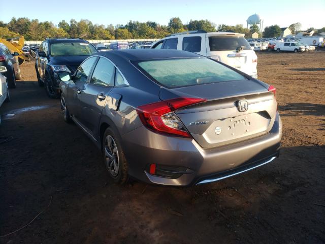 Photo 2 VIN: 2HGFC2F6XKH595867 - HONDA CIVIC LX 