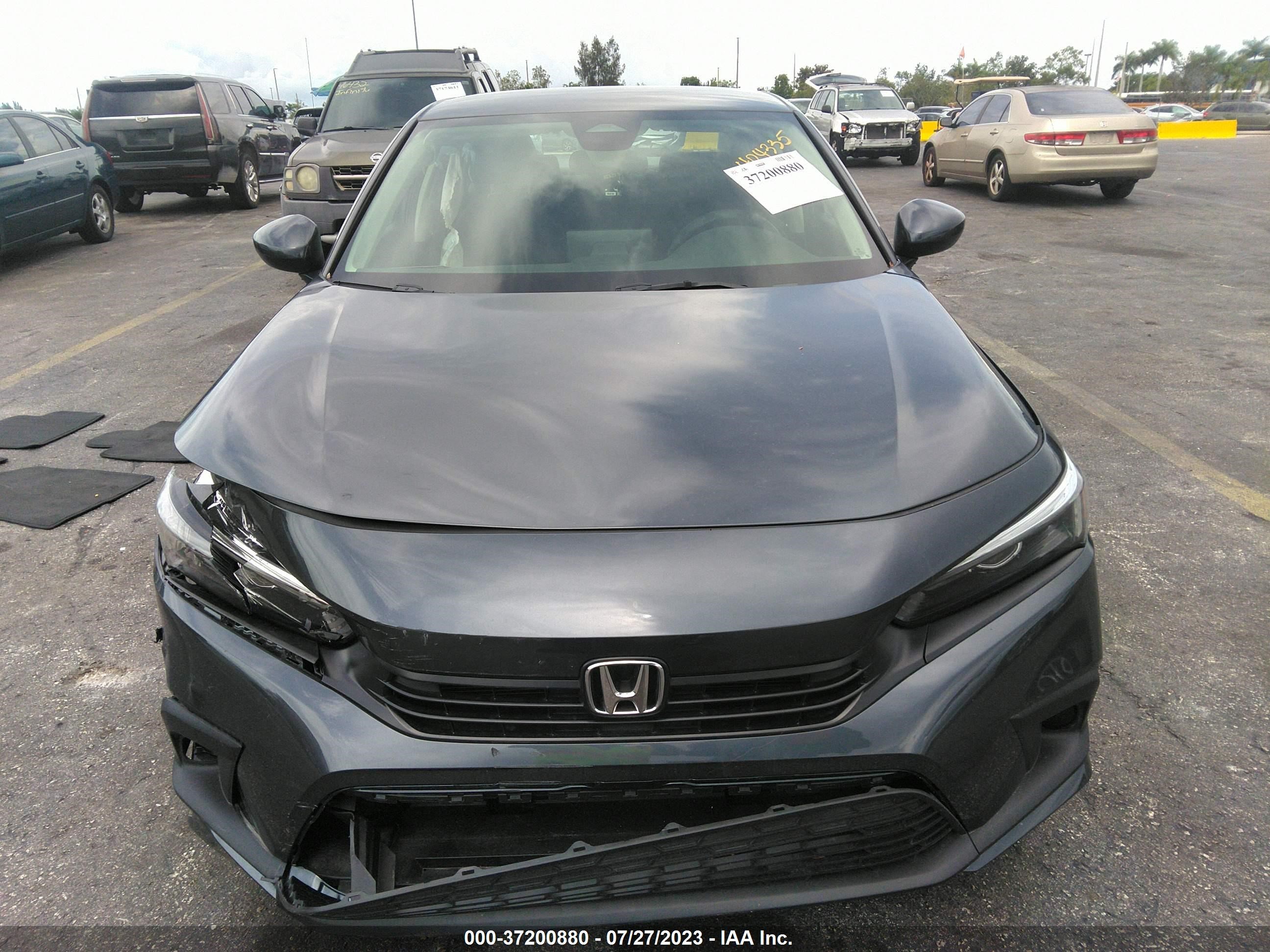 Photo 11 VIN: 2HGFE2F2XPH537725 - HONDA CIVIC 