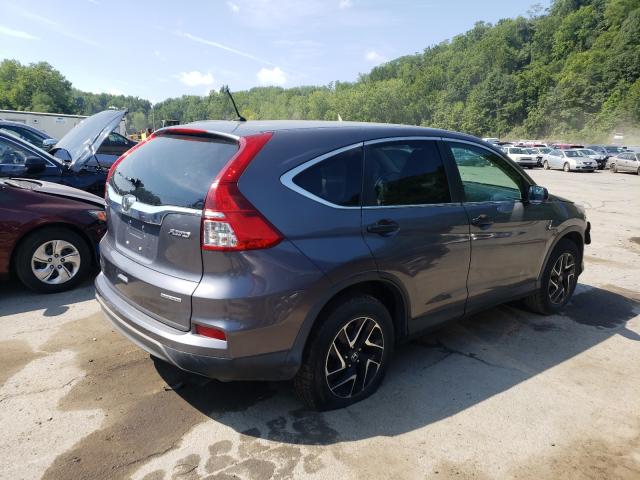 Photo 3 VIN: 2HKRM4H40GH614408 - HONDA CR-V SE 