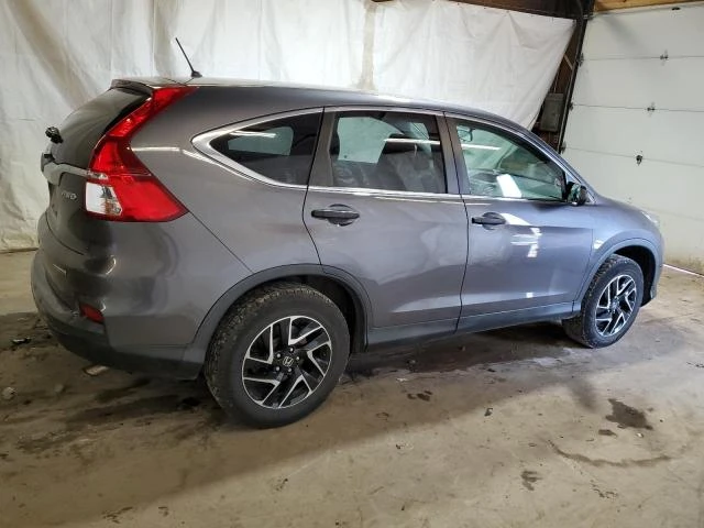 Photo 2 VIN: 2HKRM4H42GH697050 - HONDA CR-V SE 