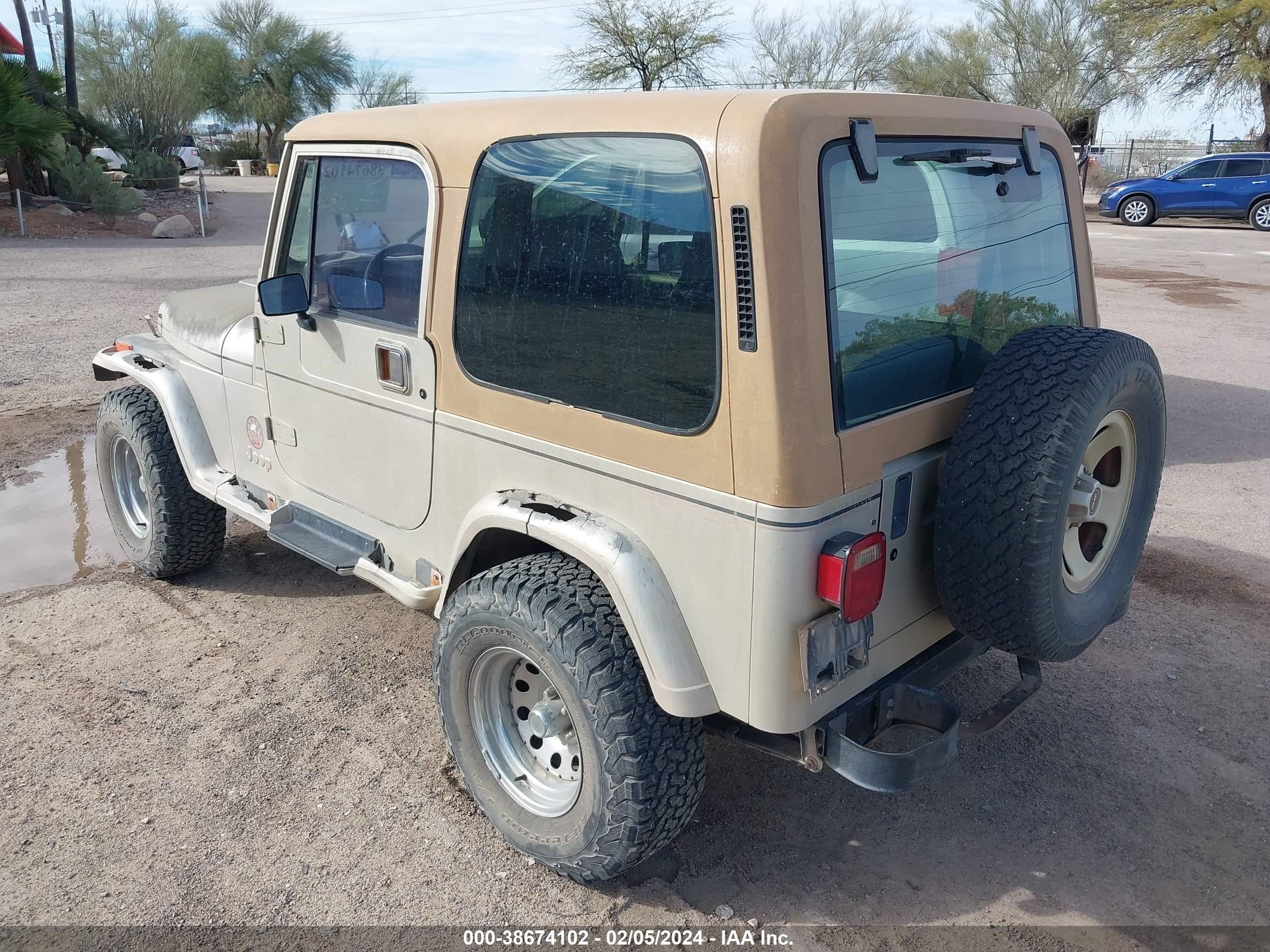 Photo 2 VIN: 2J4FY49S9NJ556571 - JEEP WRANGLER 