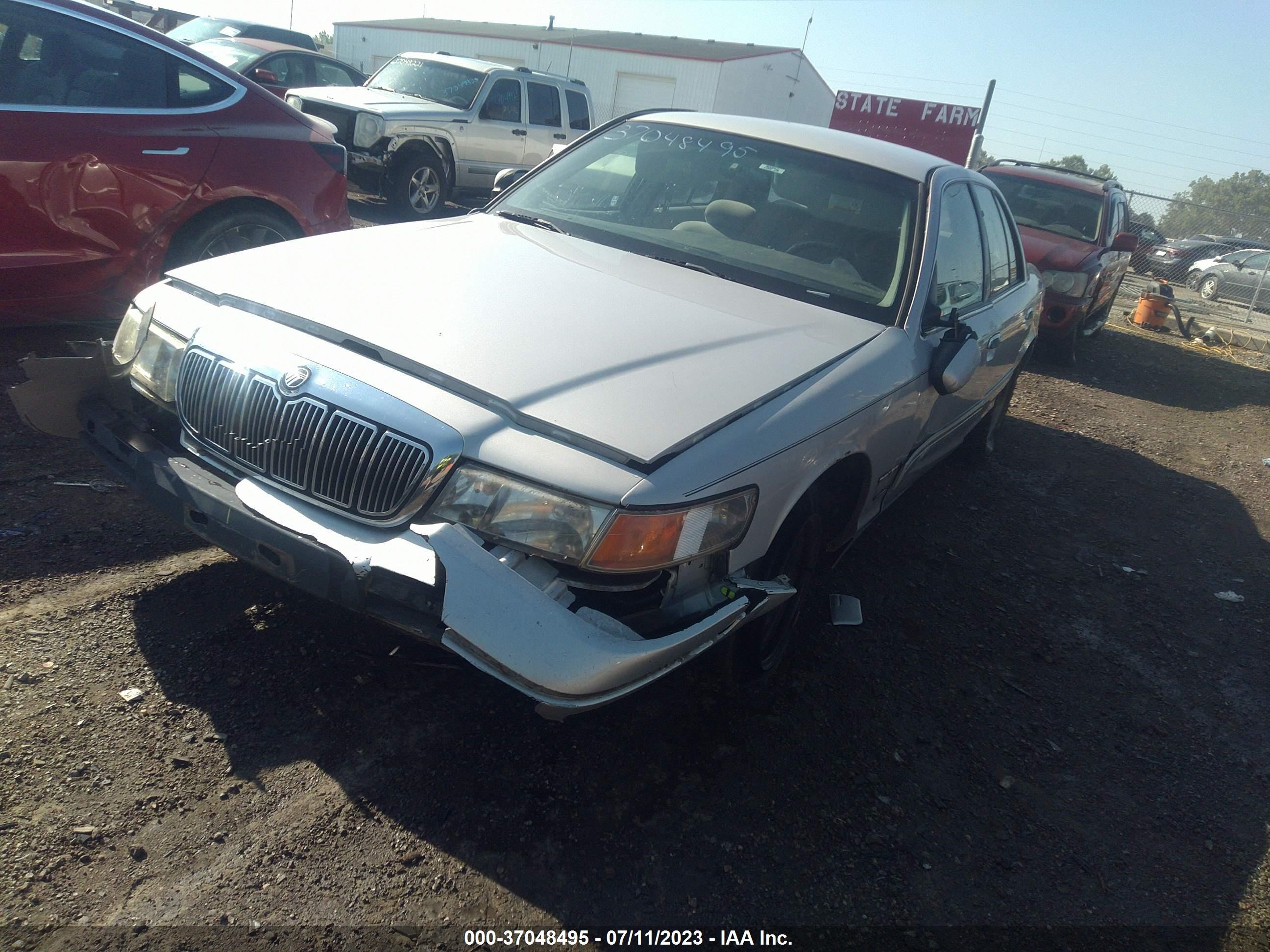 Photo 1 VIN: 2MEFM74W9XX638196 - MERCURY GRAND MARQUIS 