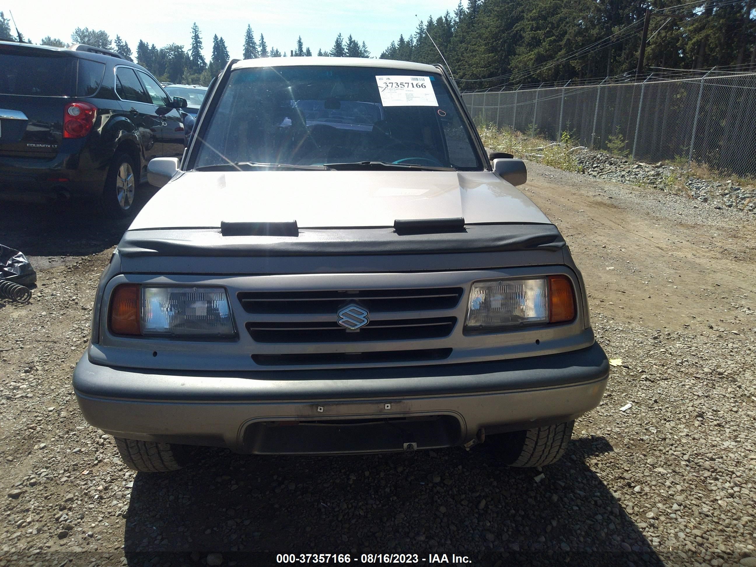 Photo 11 VIN: 2S3TD03V0T6410660 - SUZUKI SIDEKICK 