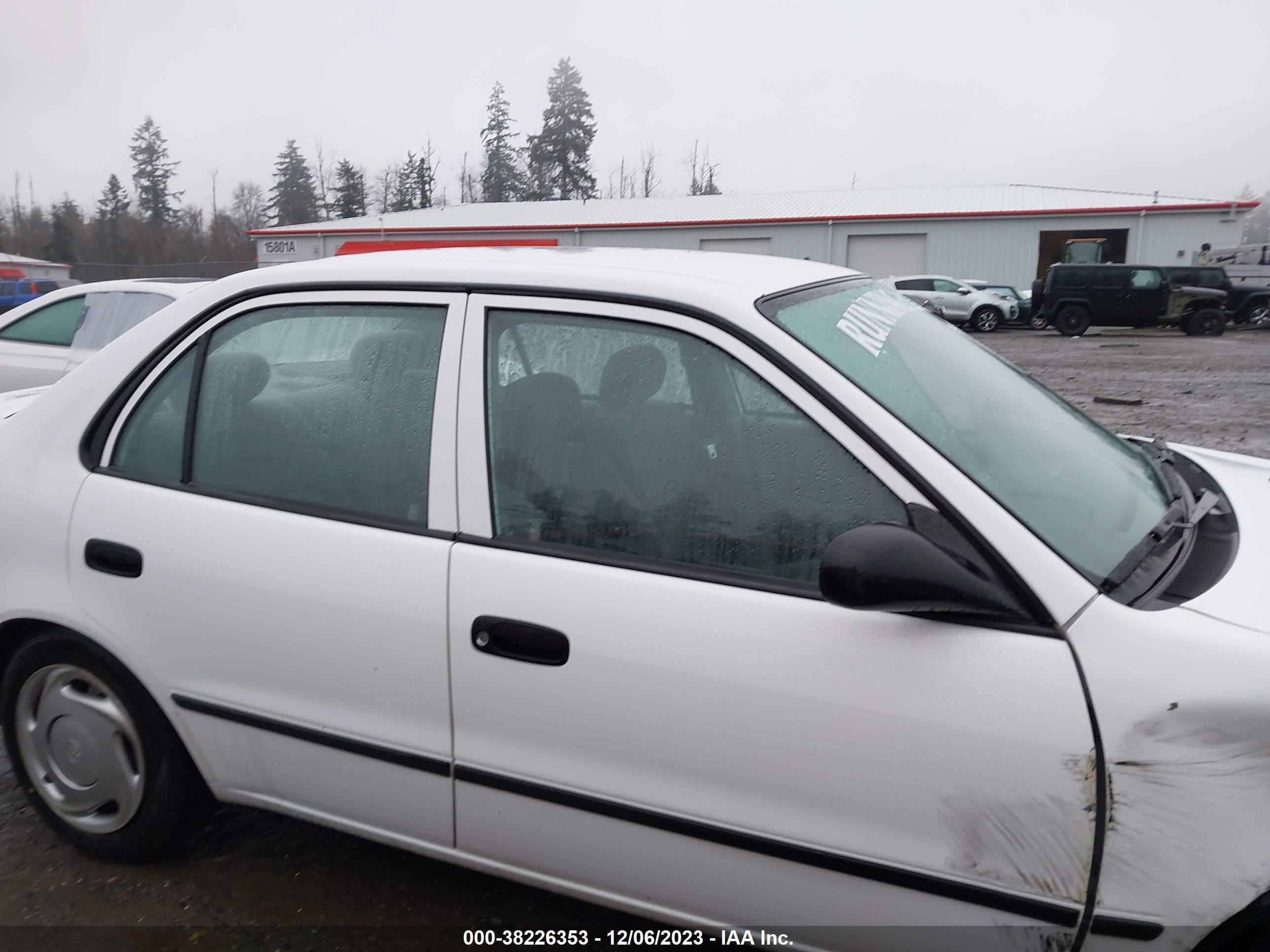 Photo 12 VIN: 2T1BR12E5YC306903 - TOYOTA COROLLA 