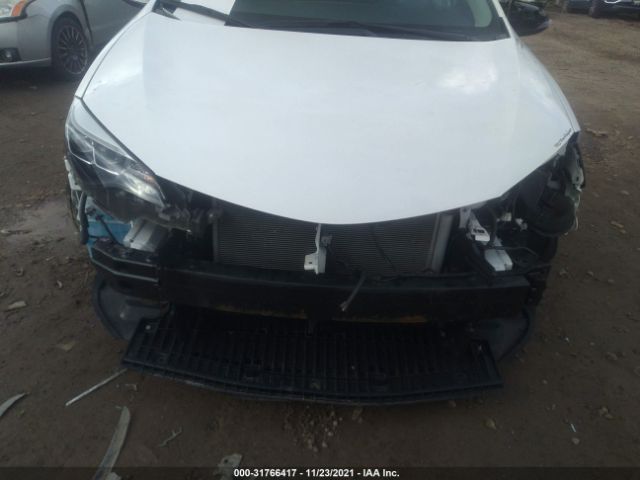 Photo 5 VIN: 2T1BURHE3KC214877 - TOYOTA COROLLA 