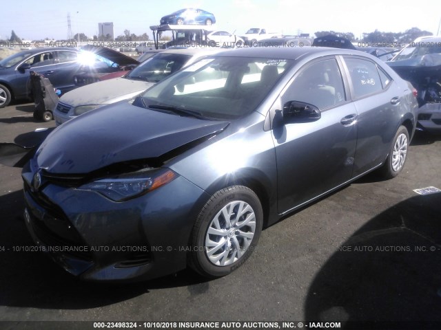 Photo 1 VIN: 2T1BURHE8JC067938 - TOYOTA COROLLA 