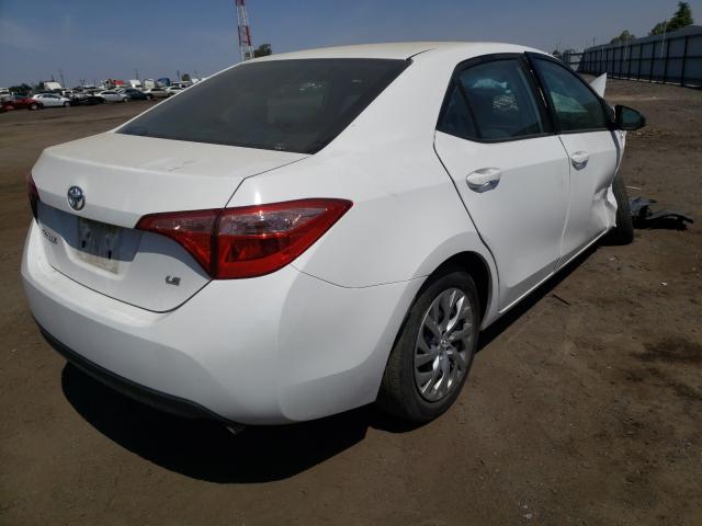 Photo 3 VIN: 2T1BURHE9KC142504 - TOYOTA COROLLA L 