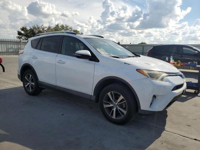 Photo 3 VIN: 2T3WFREV7GW242713 - TOYOTA RAV4 XLE 