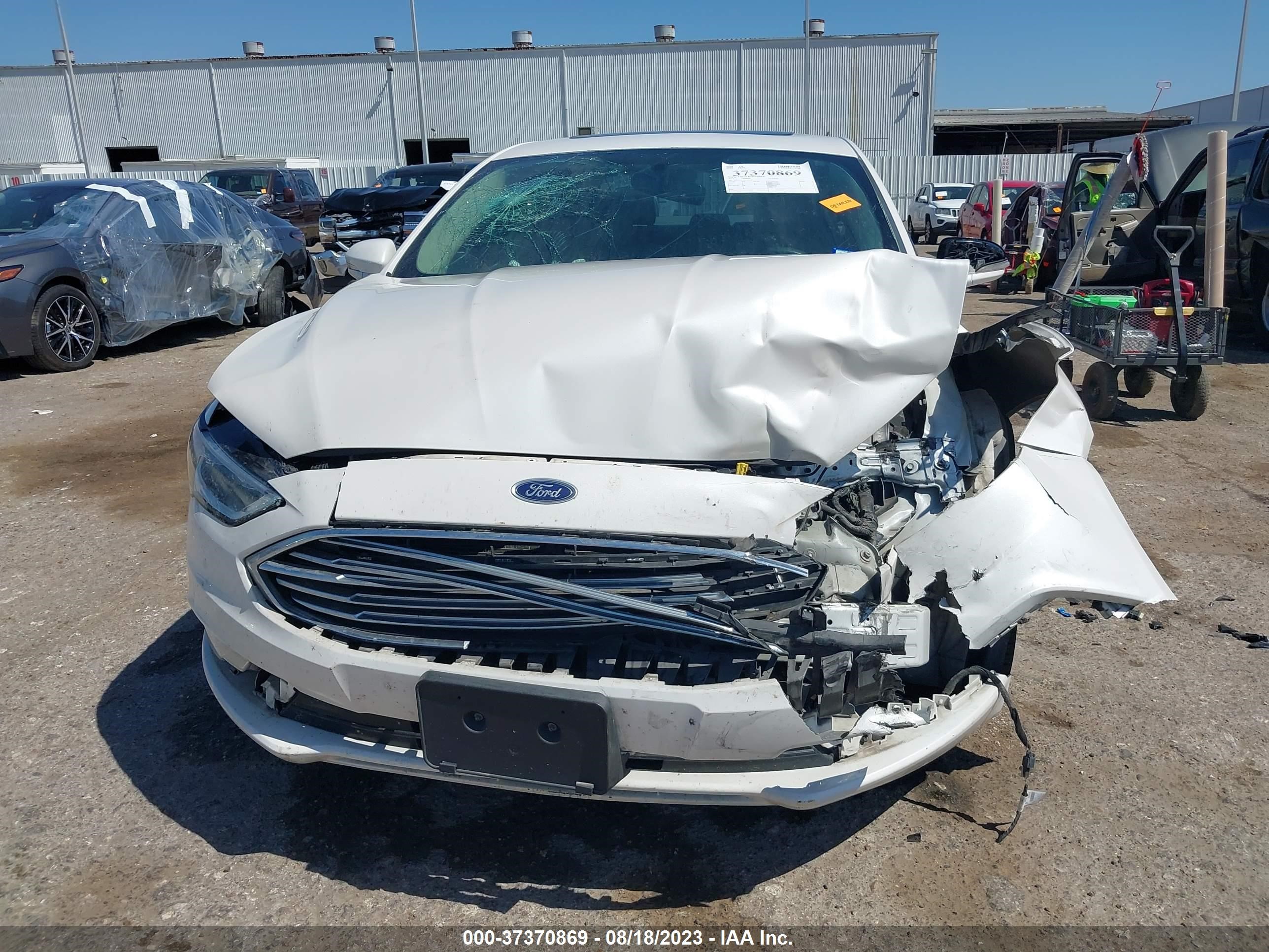 Photo 12 VIN: 3FA6P0H91HR214411 - FORD FUSION 