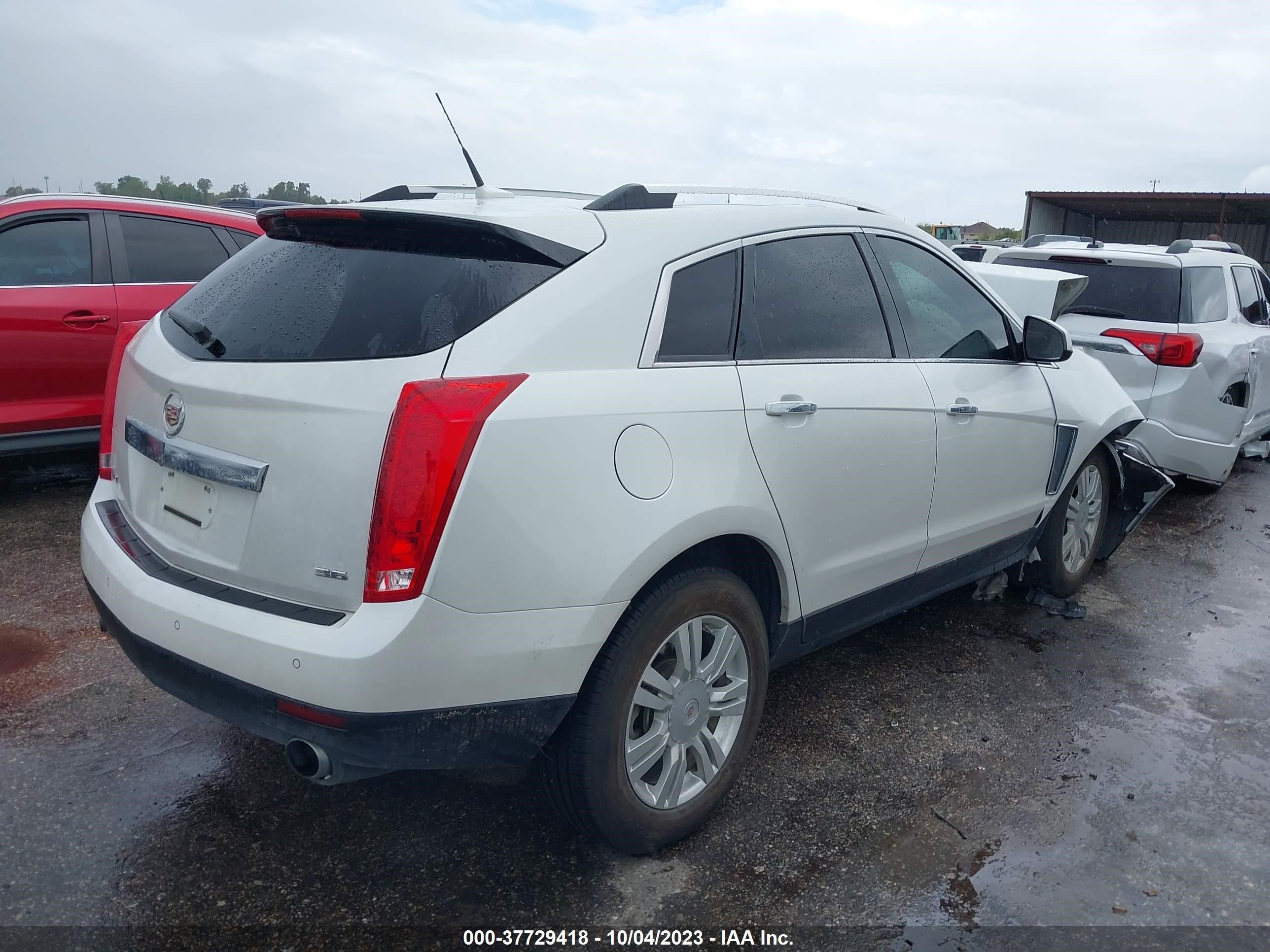 Photo 3 VIN: 3GYFNBE32ES595969 - CADILLAC SRX 