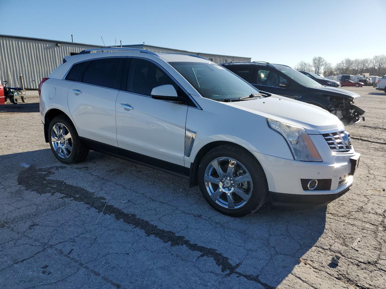 Photo 3 VIN: 3GYFNCE39GS528892 - CADILLAC SRX 