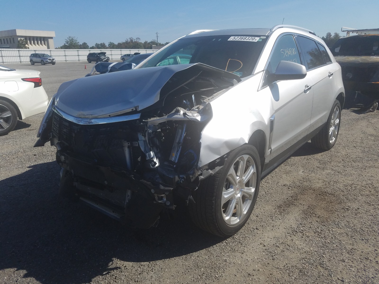 Photo 1 VIN: 3GYFNCE3XES679799 - CADILLAC SRX PERFOR 