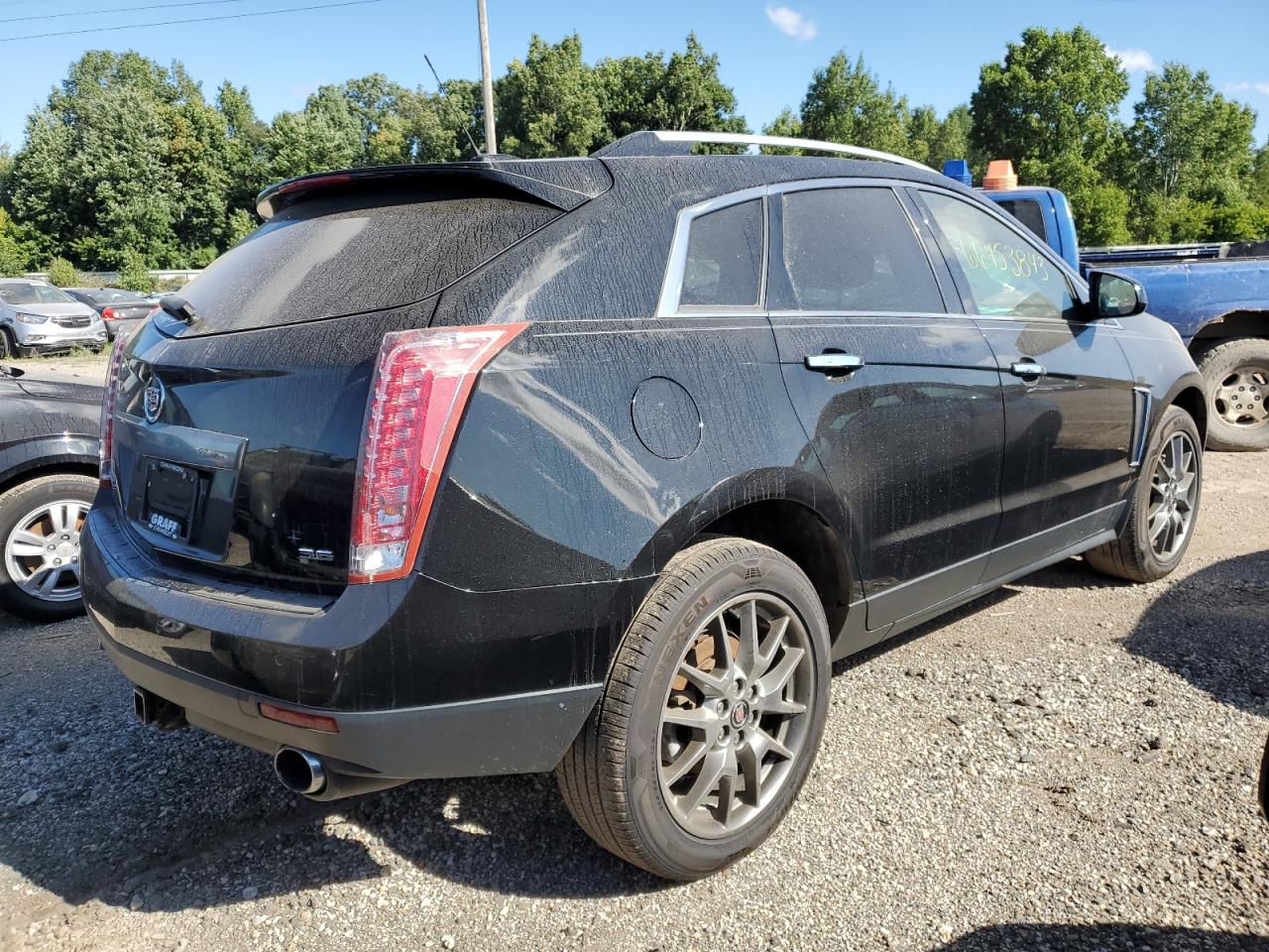 Photo 2 VIN: 3GYFNDE30GS569742 - CADILLAC SRX 