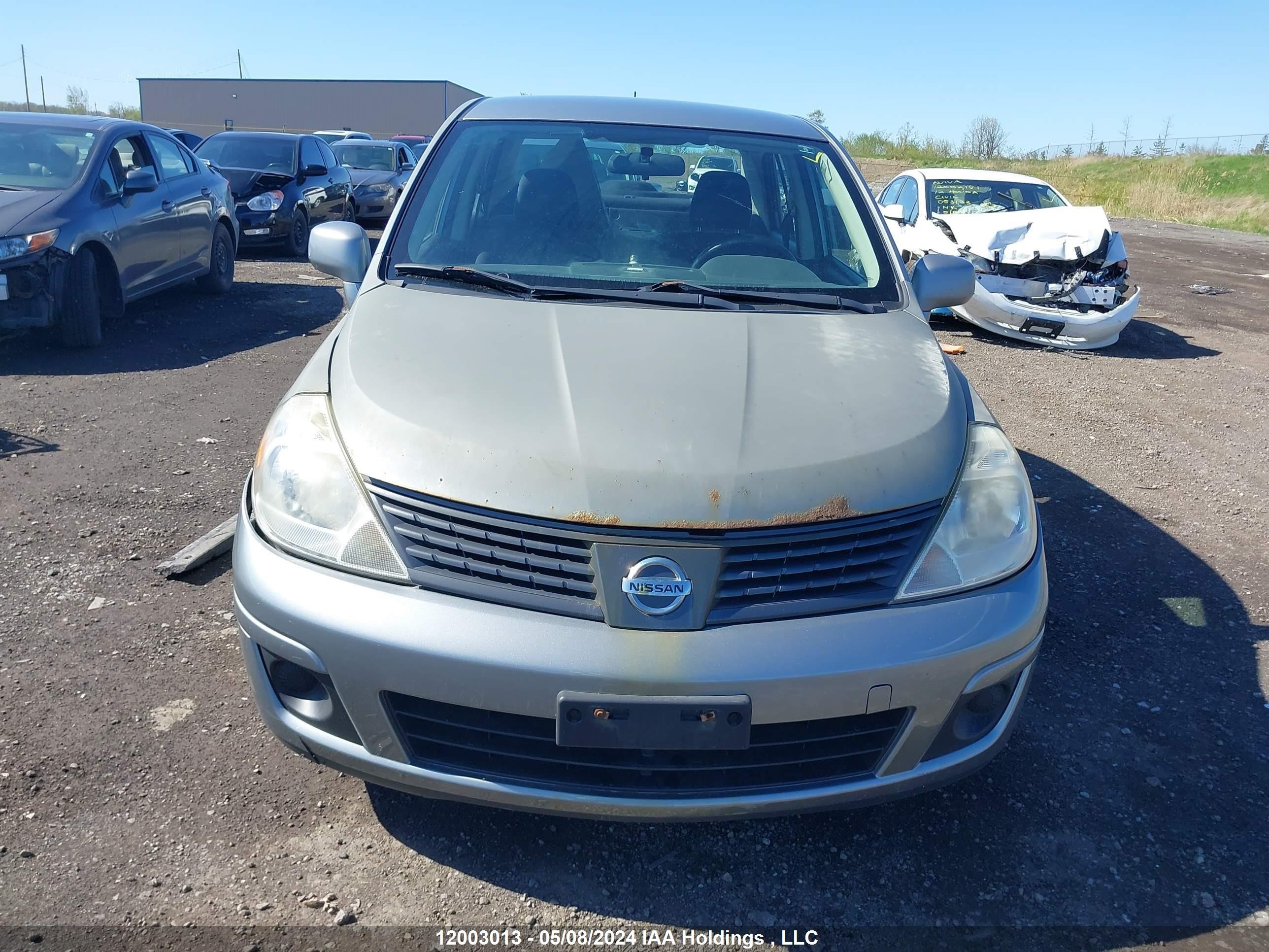 Photo 11 VIN: 3N1CC11E29L468559 - NISSAN VERSA 