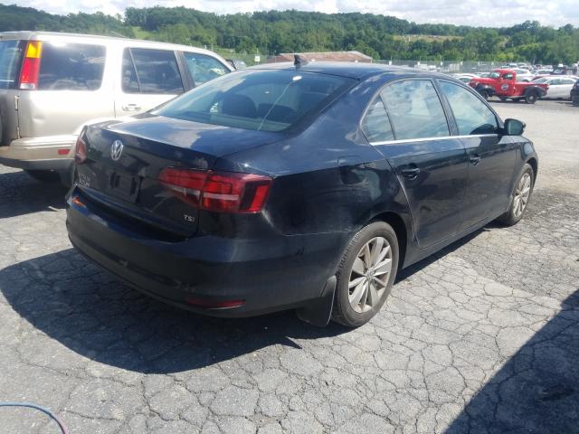 Photo 3 VIN: 3VWD67AJ0GM357540 - VOLKSWAGEN JETTA SE 