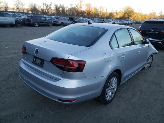 Photo 3 VIN: 3VWD67AJ7GM209031 - VOLKSWAGEN JETTA 