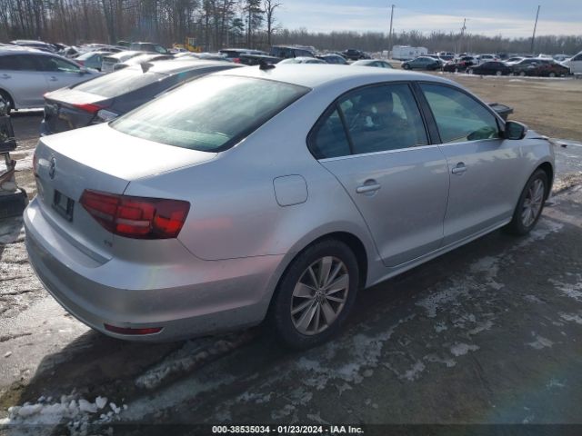 Photo 3 VIN: 3VWD67AJ7GM260304 - VOLKSWAGEN JETTA 