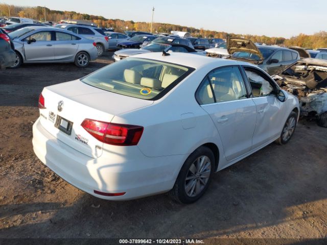 Photo 3 VIN: 3VWD67AJ8GM322566 - VOLKSWAGEN JETTA 