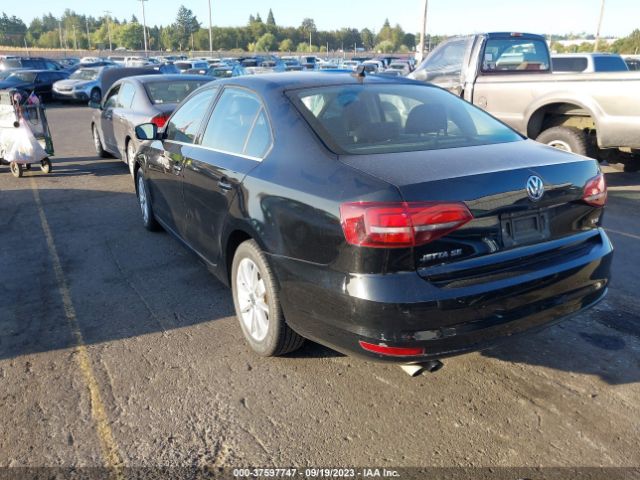 Photo 2 VIN: 3VWD67AJXGM381277 - VOLKSWAGEN JETTA SEDAN 