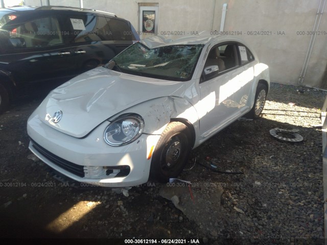 Photo 1 VIN: 3VWJ17AT4GM612242 - VOLKSWAGEN BEETLE COUPE 