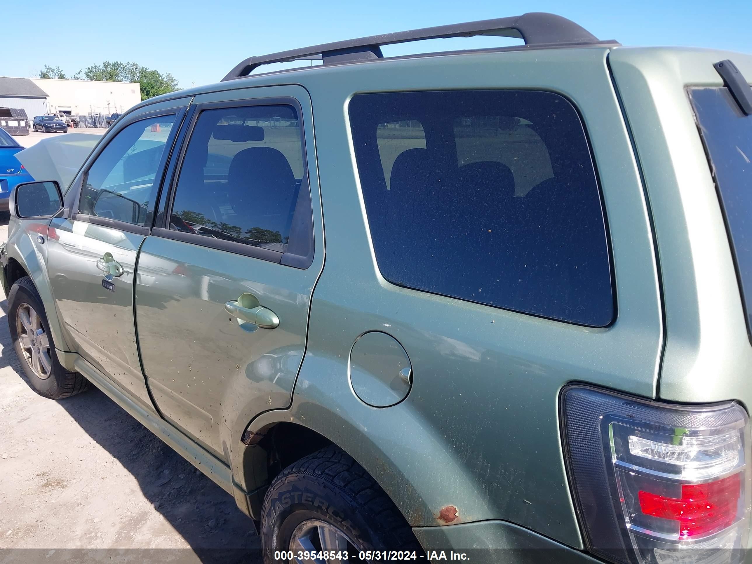 Photo 14 VIN: 4M2CU81G19KJ26634 - MERCURY MARINER 