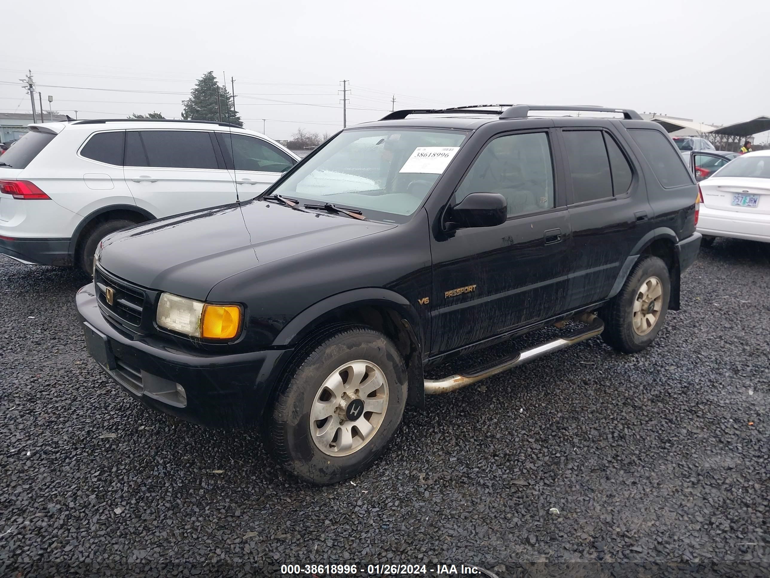 Photo 1 VIN: 4S6CM58W7X4425535 - HONDA PASSPORT 