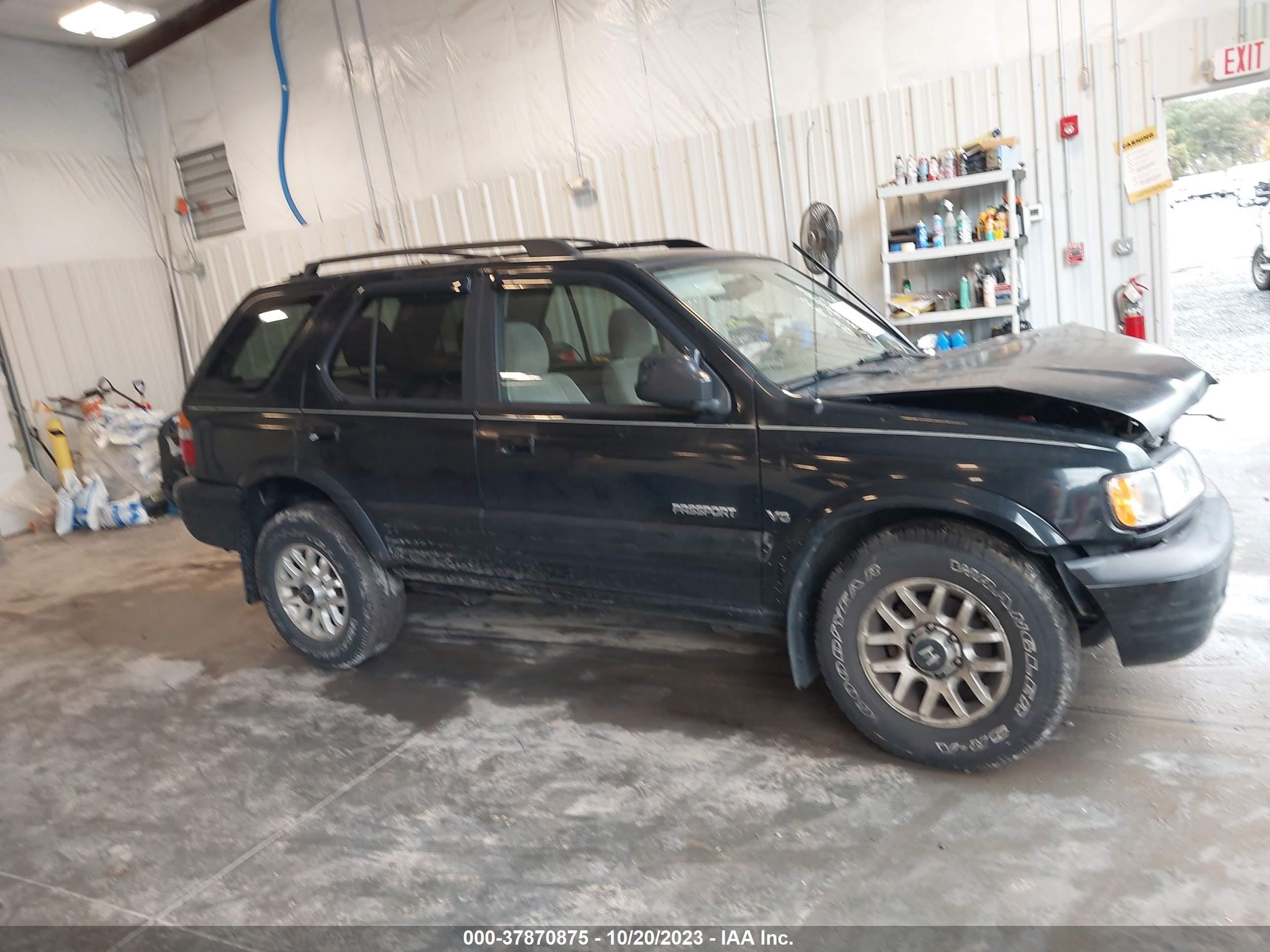 Photo 12 VIN: 4S6DM58W5Y4411400 - HONDA PASSPORT 