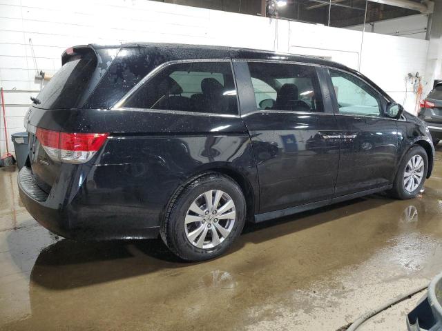 Photo 2 VIN: 5FNRL5H30GB106910 - HONDA ODYSSEY SE 