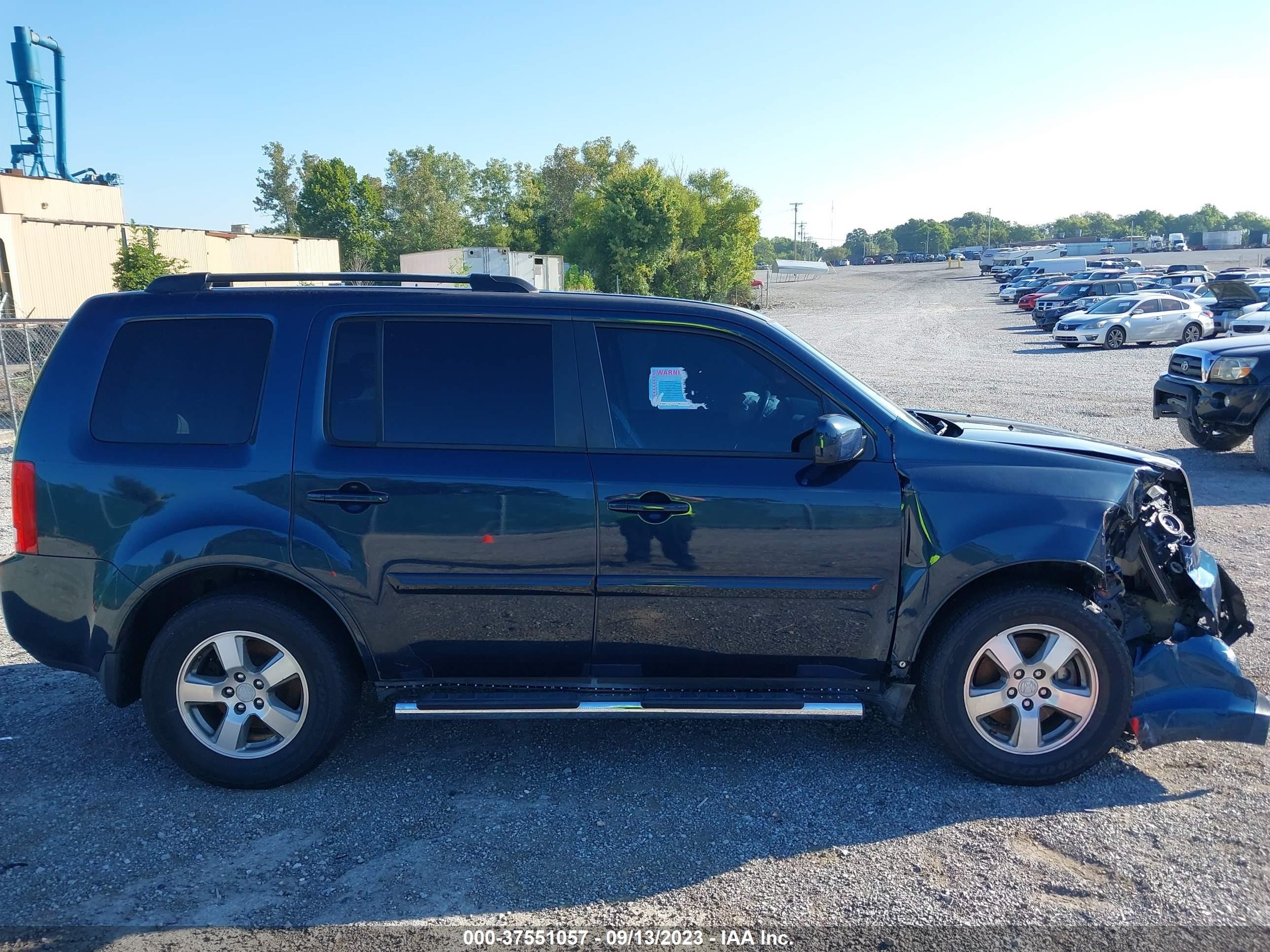 Photo 12 VIN: 5FNYF3H50BB058228 - HONDA PILOT 