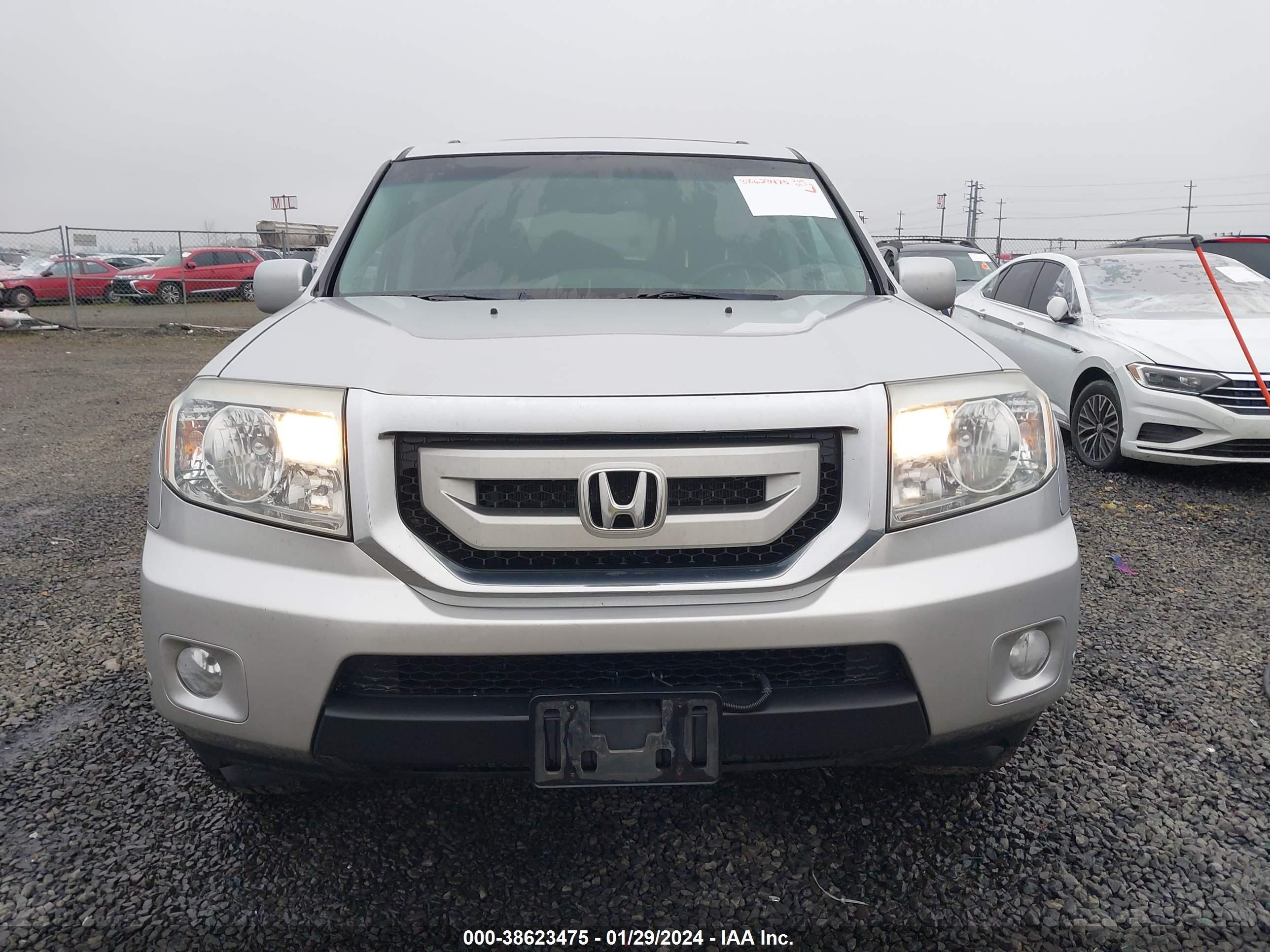 Photo 11 VIN: 5FNYF4H93BB504140 - HONDA PILOT 