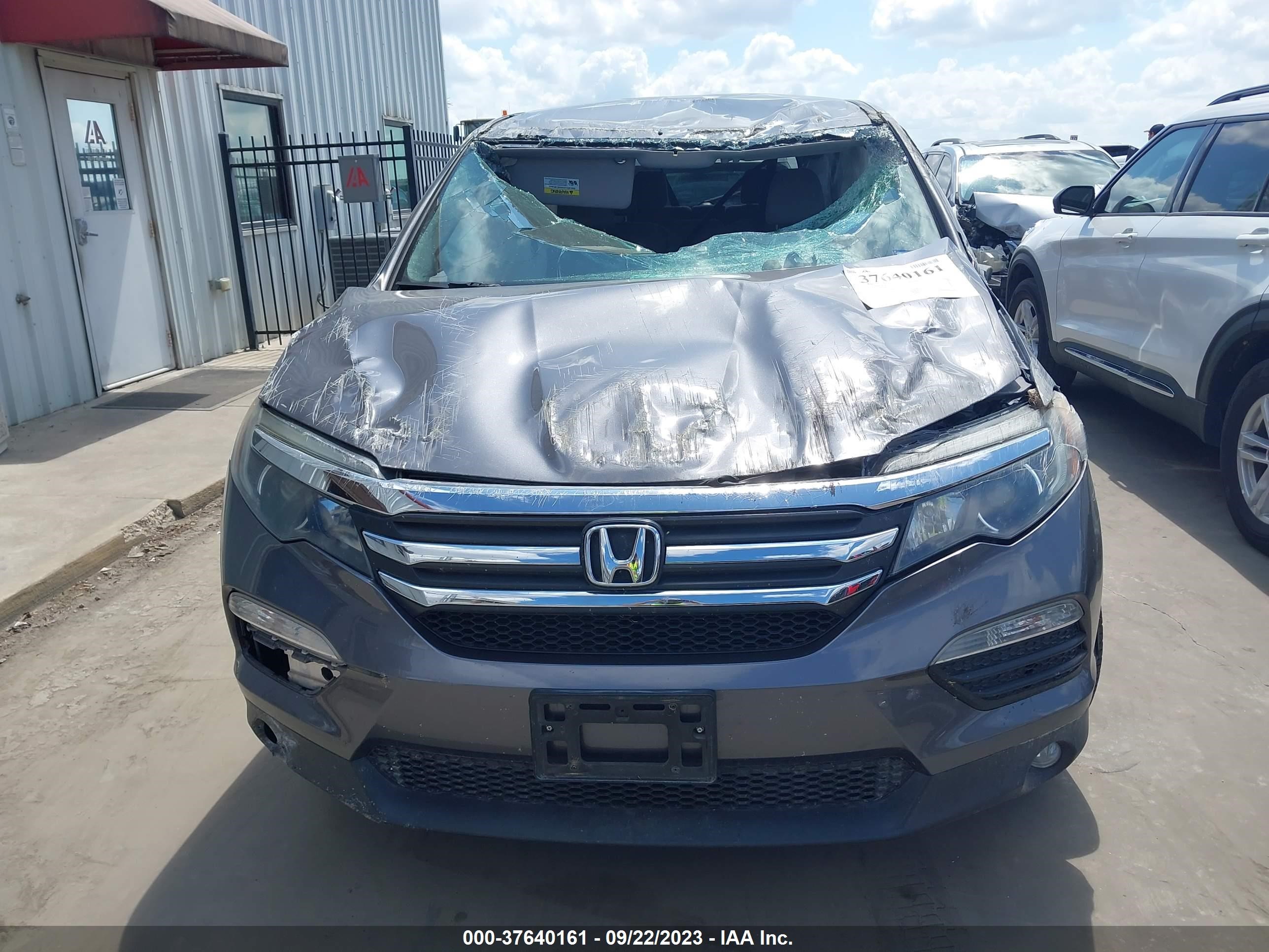 Photo 10 VIN: 5FNYF5H39GB019042 - HONDA PILOT 