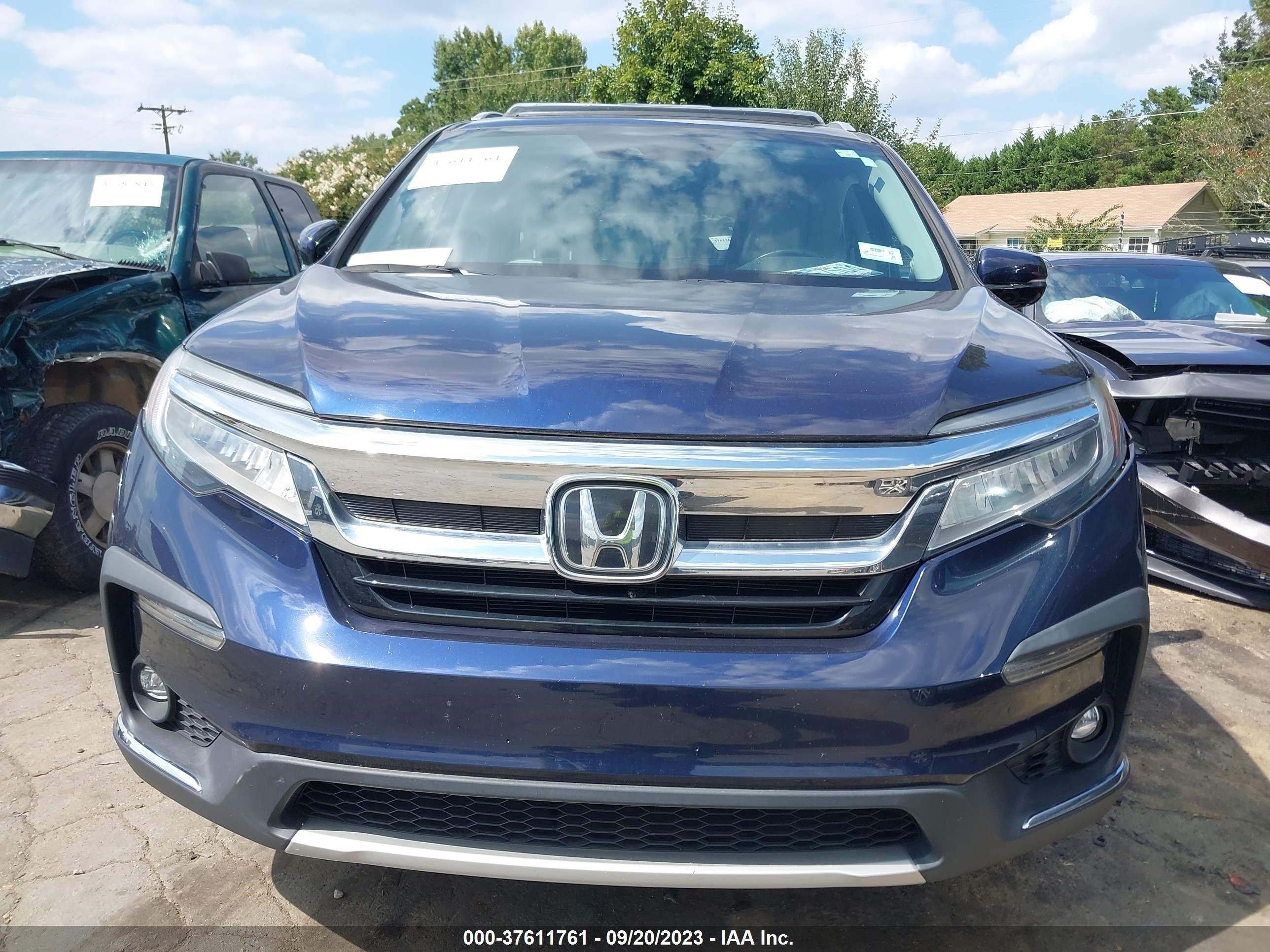 Photo 11 VIN: 5FNYF5H9XKB035876 - HONDA PILOT 