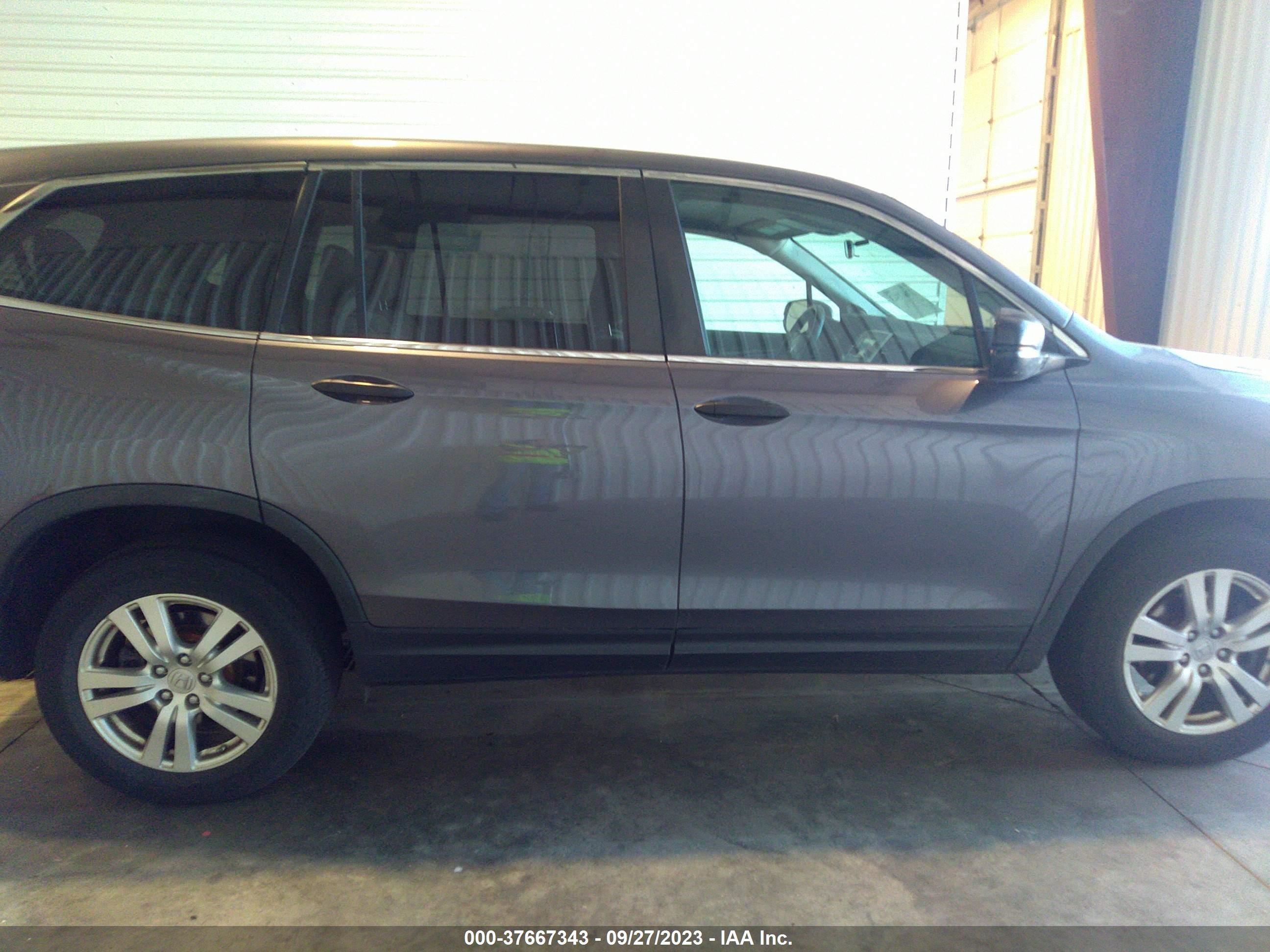 Photo 12 VIN: 5FNYF6H15GB094633 - HONDA PILOT 