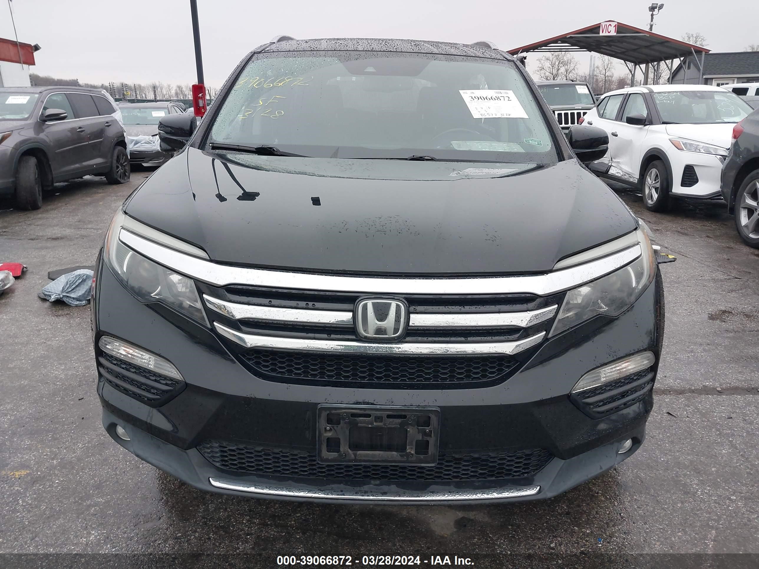 Photo 12 VIN: 5FNYF6H96GB117861 - HONDA PILOT 