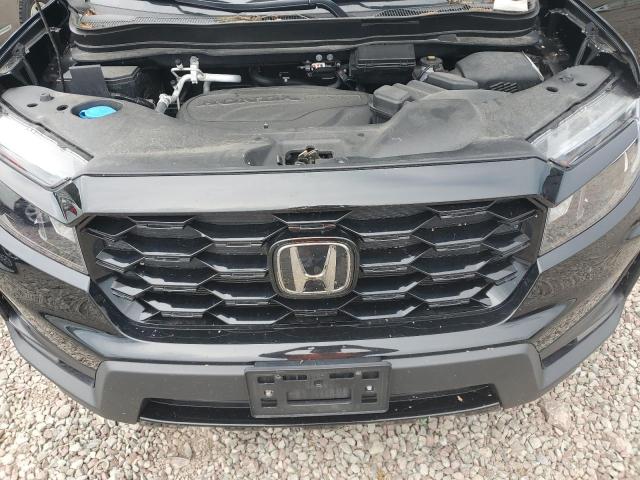 Photo 11 VIN: 5FNYF8H00PB008888 - HONDA PASSPORT E 