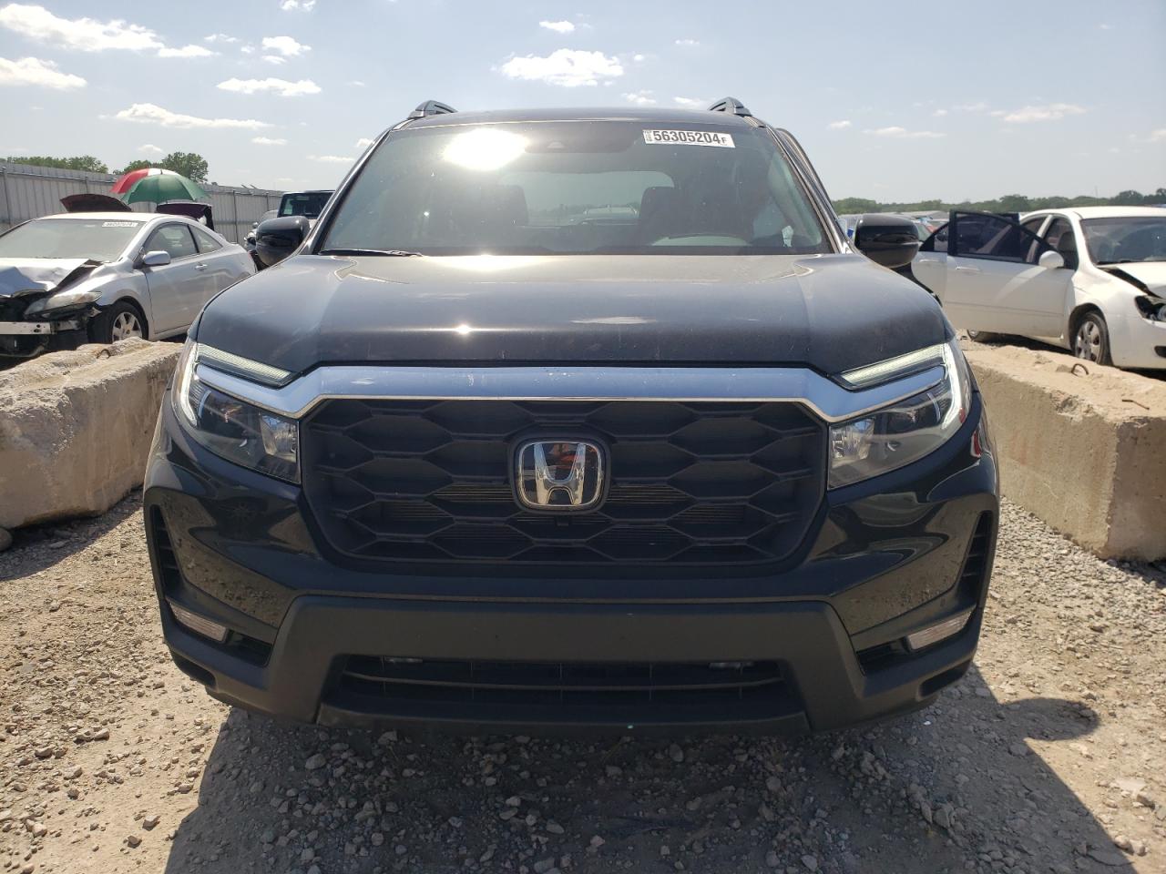 Photo 4 VIN: 5FNYF8H51PB035769 - HONDA PASSPORT 