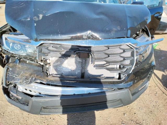 Photo 10 VIN: 5FNYF8H5XPB014676 - HONDA PASSPORT E 