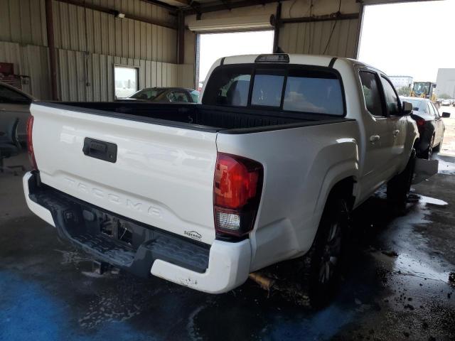 Photo 2 VIN: 5TFAX5GN6KX141874 - TOYOTA TACOMA DOU 