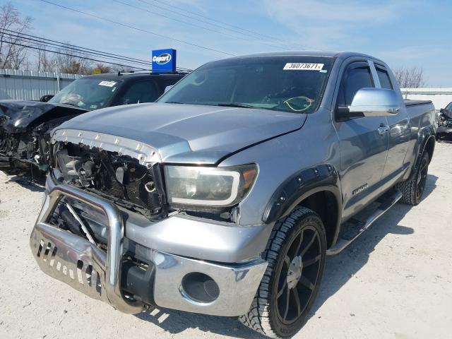 Photo 1 VIN: 5TFRM5F14CX041610 - TOYOTA TUNDRA DOU 