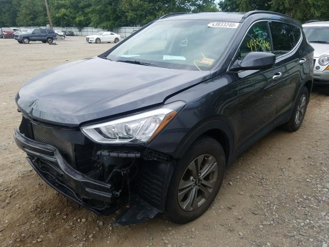 Photo 1 VIN: 5XYZUDLB2GG334874 - HYUNDAI SANTA FE S 