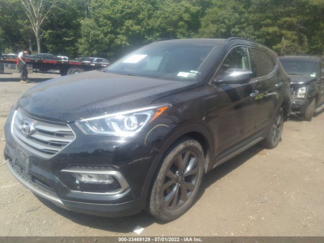 Photo 1 VIN: 5XYZWDLAXJG518811 - HYUNDAI SANTA FE SPORT 