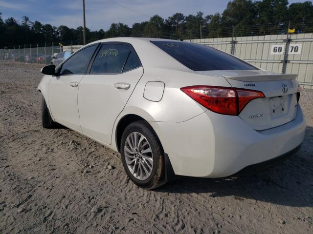 Photo 2 VIN: 5YFBPRHE2JP821777 - TOYOTA COROLLA LE 