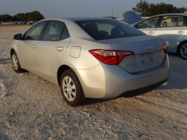 Photo 2 VIN: 5YFBURHE0JP771017 - TOYOTA COROLLA L 