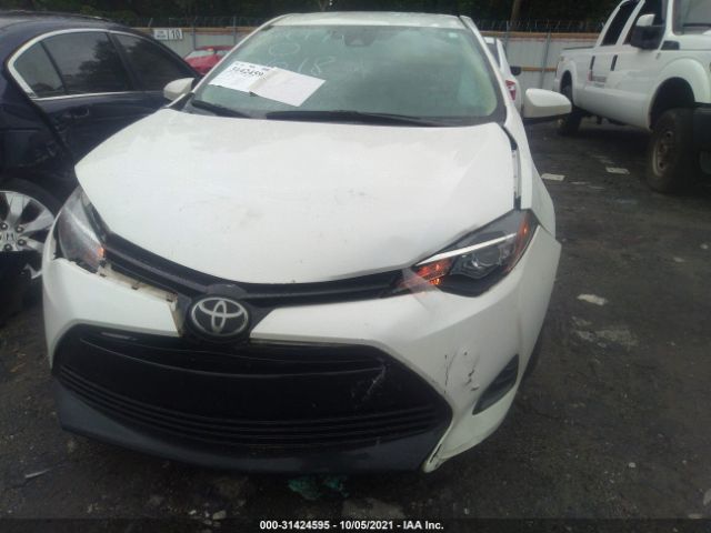 Photo 5 VIN: 5YFBURHE0JP790618 - TOYOTA COROLLA 