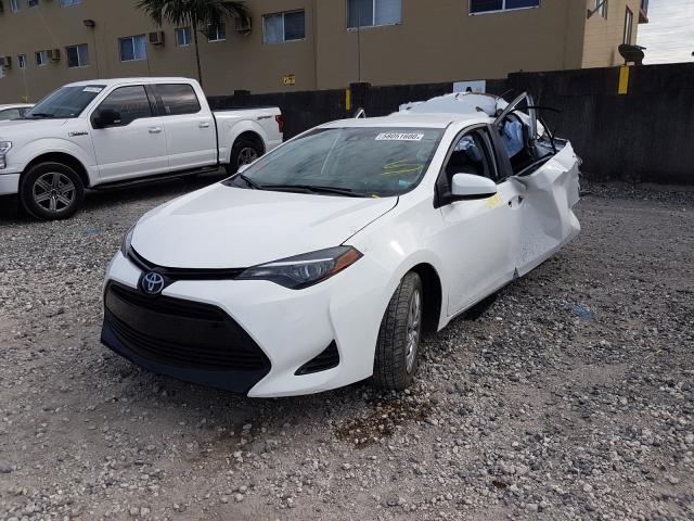 Photo 1 VIN: 5YFBURHE0JP807286 - TOYOTA COROLLA L 