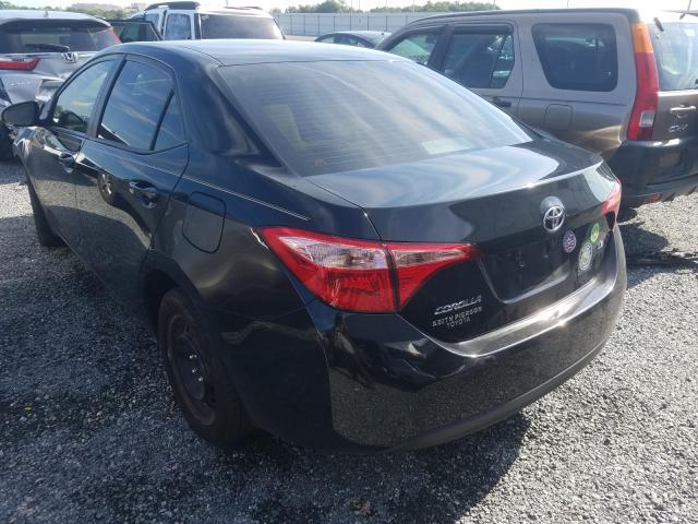 Photo 2 VIN: 5YFBURHE0KP859454 - TOYOTA COROLLA L 